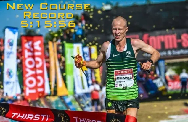 George Kusche over the finish line. 