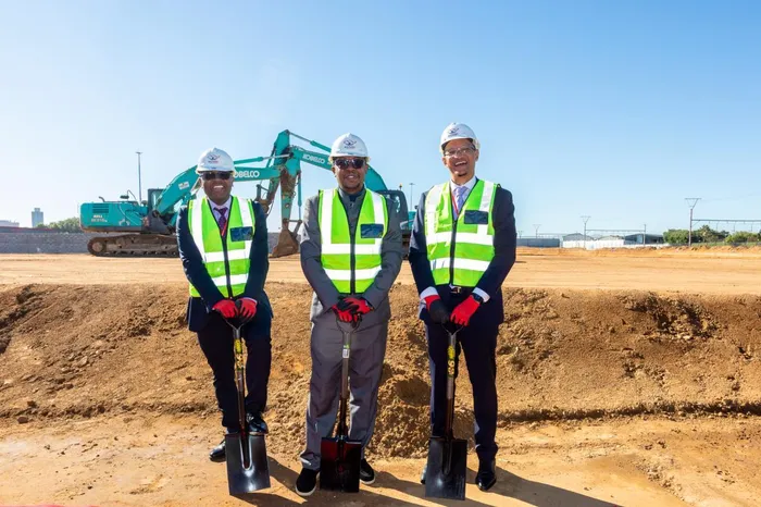 Minister of Trade, Industry and Competition, Parks Tau, with the Director-General of the Department of Science, Technology and Innovation, Dr Mlungisi Cele, and Biovac CEO, Dr Morena Makhoana, at the Biovac Pharma facility in Cape Town.
