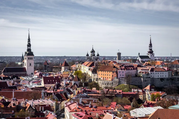 A scenic aerial view capturing the ancient towers and historic rooftops of Tallinn's old town in Estonia.