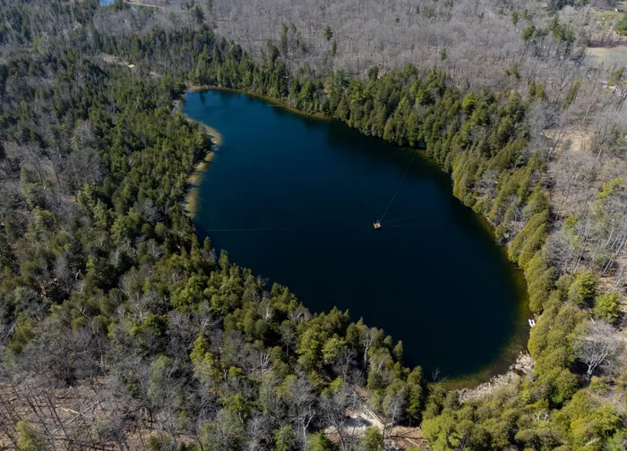 File: An aerial view of Crawford Lake as a team consisting of scientists from Carleton University and Brock University gather sediment layer samples from the bottom of the lake at the Crawford Lake Conservation Area near Milton, Ontario, Canada, April 12, 2023. Picture: Peter Power AFP