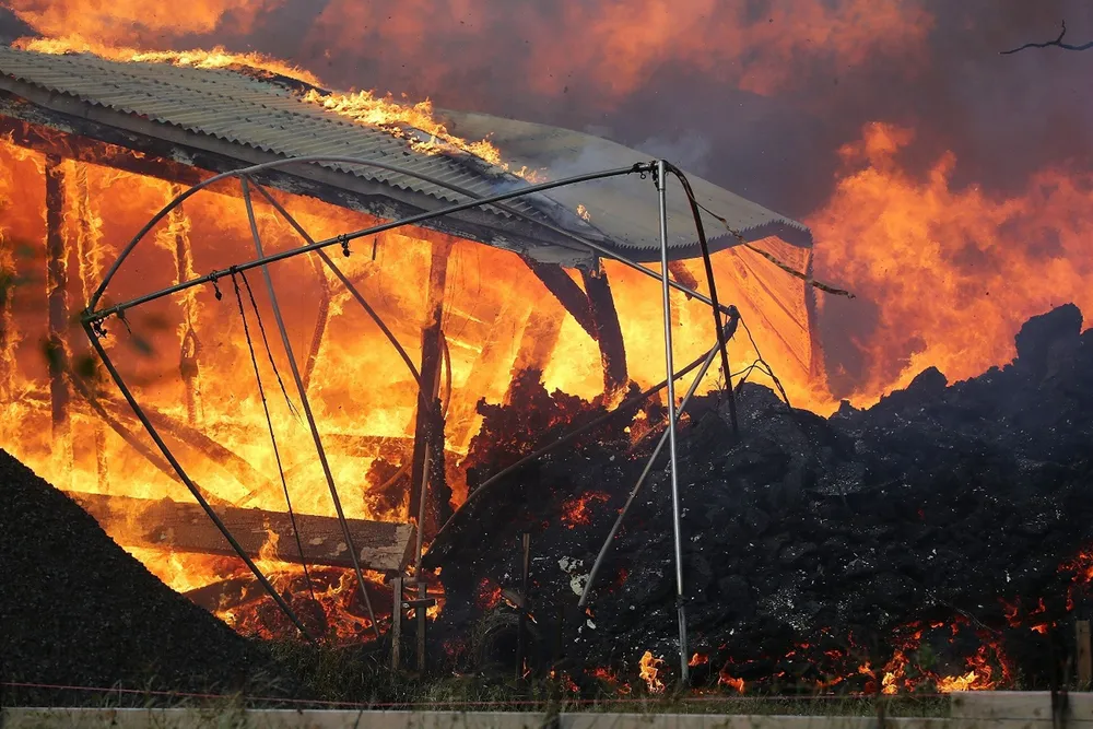 A home is destroyed by lava from a Kilauea volcano fissure in Leilani Estates, on Hawaii's Big Island, on May 25, 2018, in Pahoa, Hawaii. Following a magnitude 4.4 earthquake,  centered in the summit region of the Kilauea volcano, an ash plume was sent from the volcano at least 3km skyward, according to the National Weather Service.  Picture: Mario Tama/Getty Images/AFP