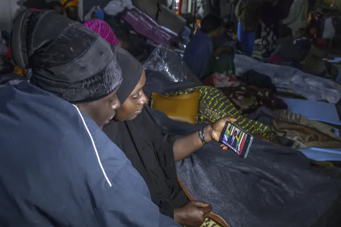 Foreign nationals, who are camped outside the Department of Home Affairs offices in Durban, used their mobile phones last night to watch President Cyril Ramaphosa's address on the immigration issue. The group who have been outside the premises for the past few weeks, claims violence and threats led them to flee their homes in the CBD.