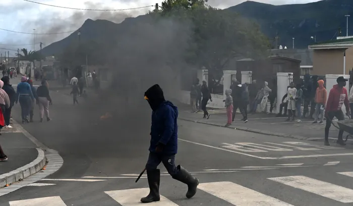 Explore the persistent issue of xenophobia in South Africa and its devastating economic impact, as revealed through a study of violence against foreign-owned spaza shops. 