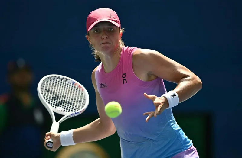 Poland's Iga Swiatek plays against Russia's Kamilla Rakhimova during their women's singles first round match on day two of the US Open tennis tournament on Tuesday