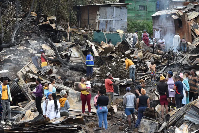 The community of Clare Estate Informal settlement was left in the open when an estimated number of 80 shacks caught fire in the middle of the night, leaving them stranded in the cold. Picture: Tumi Pakkies/African News Agency(ANA)
