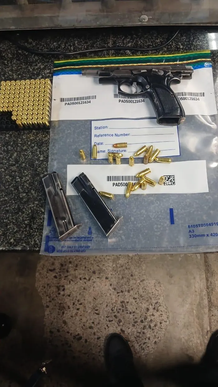 Firearms and over 100 rounds of ammunition were seized from the suspects. 