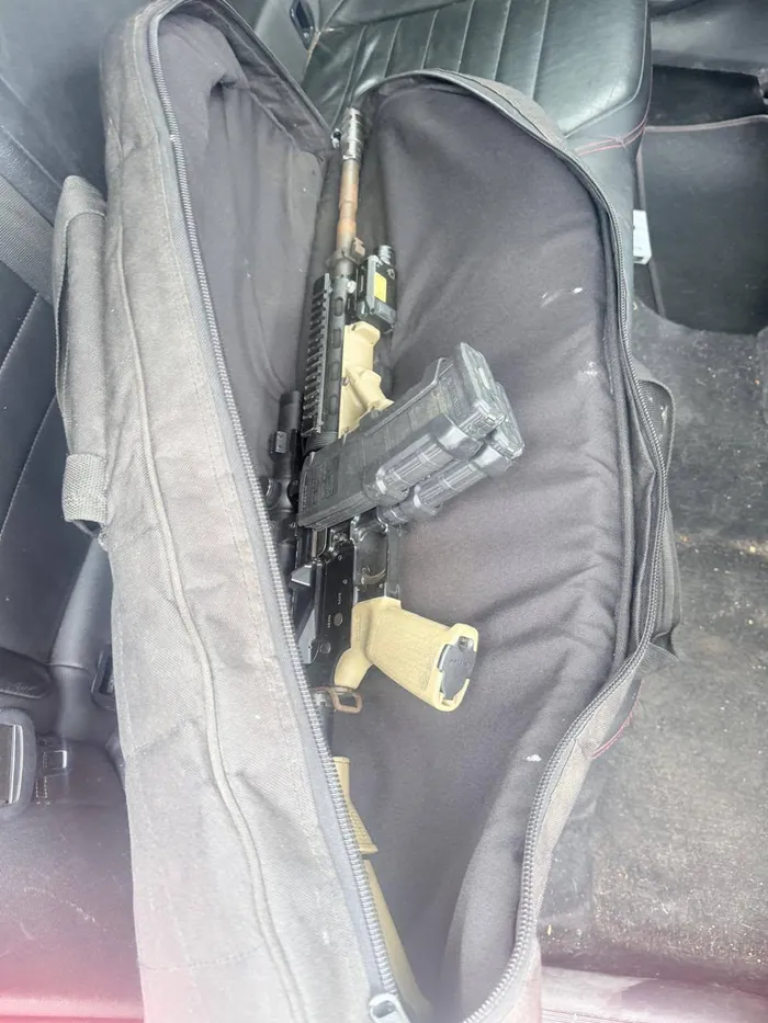 SEIZED: Two assault rifles recovered.