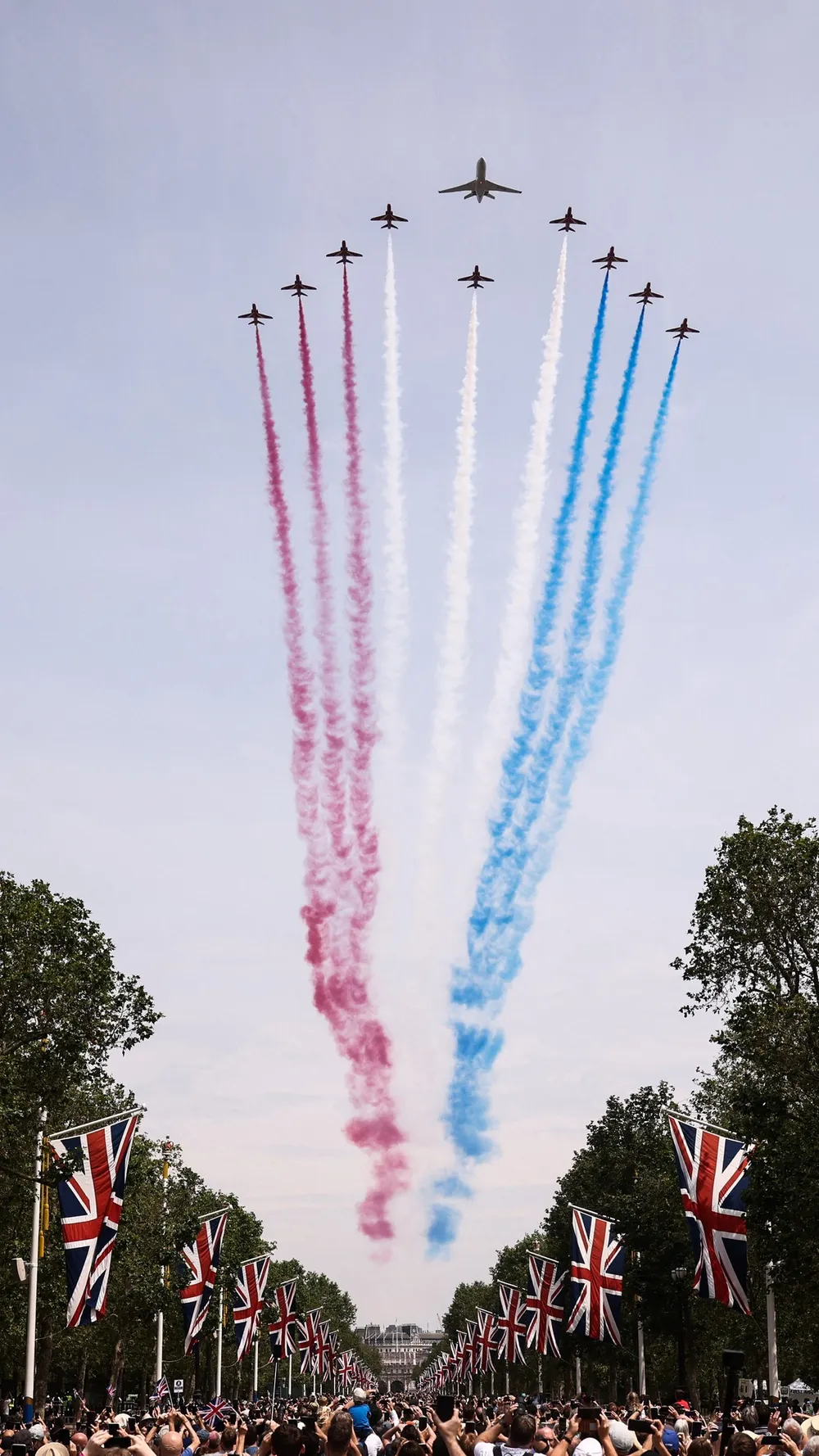 Members of the public watch a fly-past of aircraft by the Britain's Royal Air Force (RAF) from The Mall, as part of the King's Birthday Parade, 'Trooping the Colour', in London on June 17, 2023. Picture: Henry Nicholls / AFP