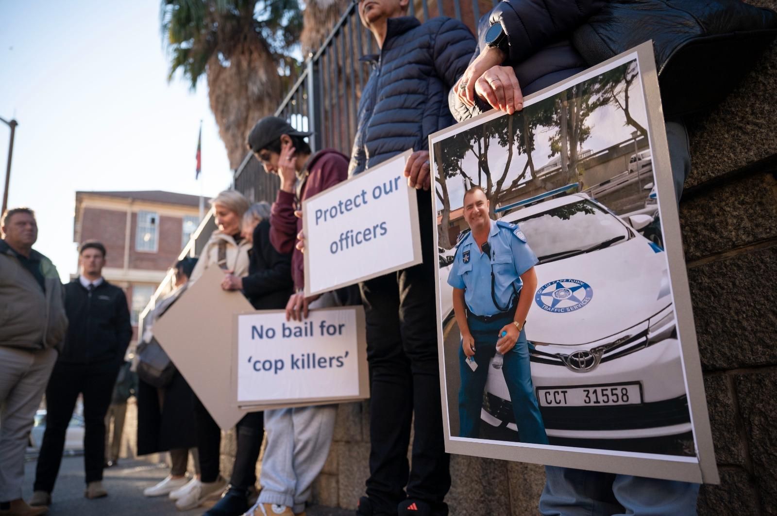 Emotional court hearing as State opposes bail for alleged cop killer