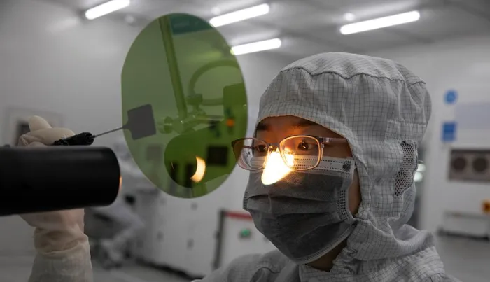 A staff member works at the workshop in the headquarters of TankeBlue Semiconductor Co., Ltd. in Daxing District of Beijing, capital of China