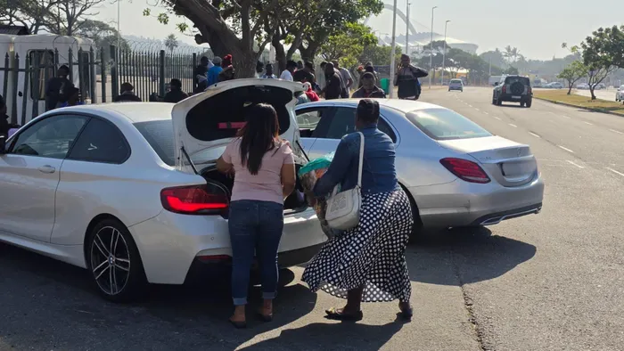 Employers dropping off their undocumented workers outside the Drive-In site. 