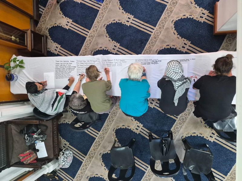 Cape Town campaign writes names of Palestinian children killed in Gaza on 20-metre shroud