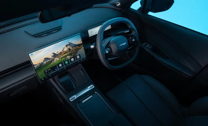 A clean, tech-focused cabin anchored by twin digital displays.