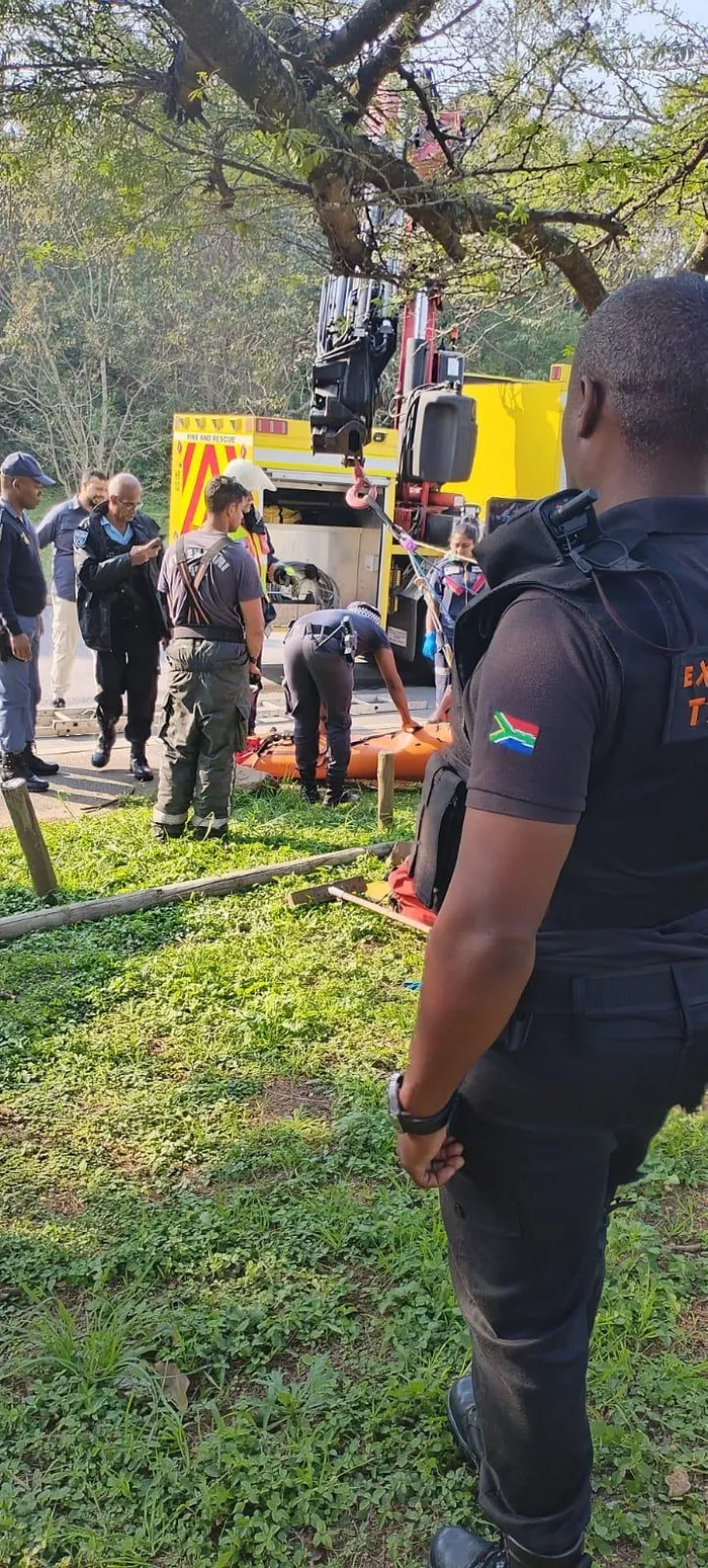 Responders at the scene where the man was pushed into a drain in Durban North.