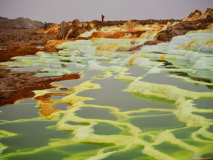 On your adventure in Ethiopia, venture into the surreal Danakil Depression, where neon-coloured sulphur pools create landscapes that resemble another planet.