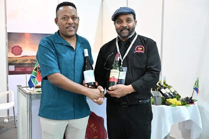 The owner of La RicMal Wines, Malcolm Green, with a potential client in at the exhibition during the Feira Internacional de Angola (FILDA).

