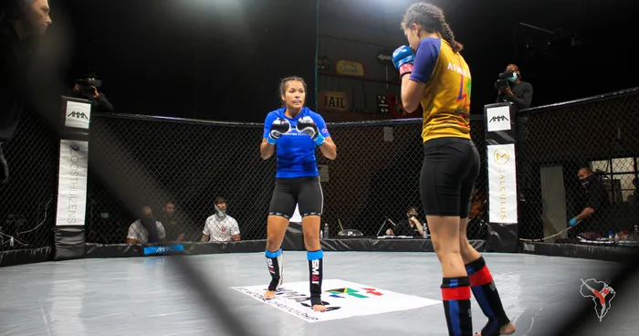 Aneesha Mayman loads up during her victorious bout over Saskia Jade Jantjes at the AMMA Underground during MMA SA Amateur Championship on Friday. Picture: Tamryn Christians, MzansiMMA