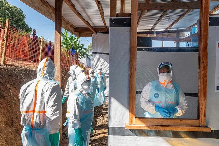 Health workers stand in a new Ebola treatment centre during a visit of Tedros Adhanom Ghebreyesus, director-general of the World Health Organization, in Bunia, Democratic Republic of the Congo, May 31, 2026. 