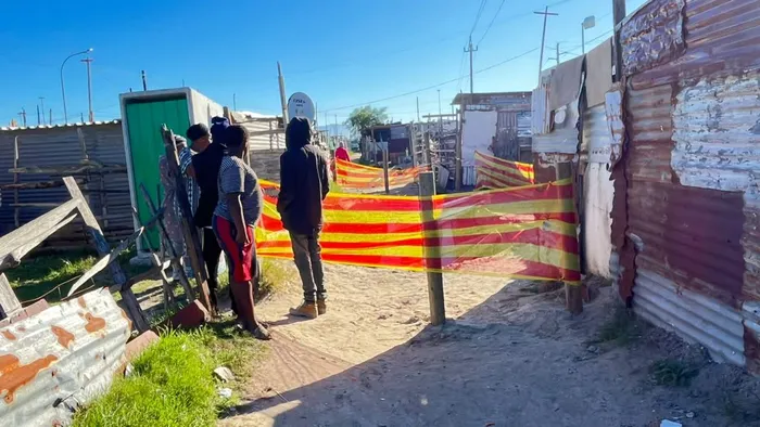 Residents gathered at the scene, watching as the dangerous sinkhole was barricaded after the dramatic rescue of the five-year-old girl.