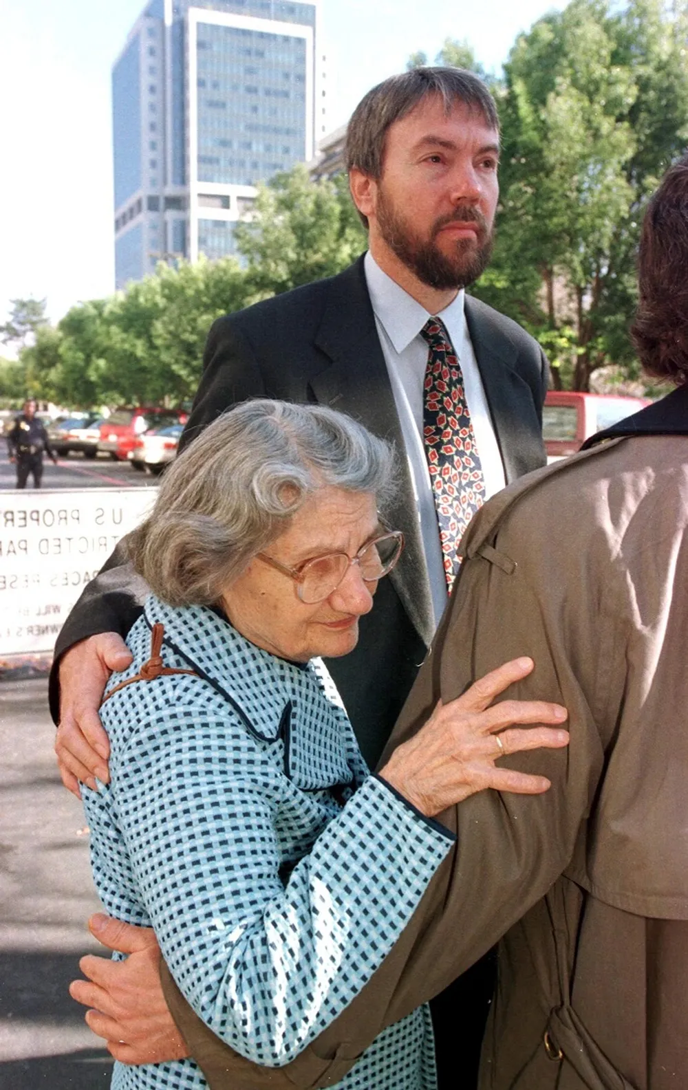 Wanda Kaczynski, left, the mother of suspected Unabomber Ted Kaczynski, is held by her son David, back right, outside the Federal Courthouse in Sacramento, California.  The Unabomber is suspected of killing 3 people and injuring 29 with home-made bombs.  File picture: RICH PEDROCELLI / AFP