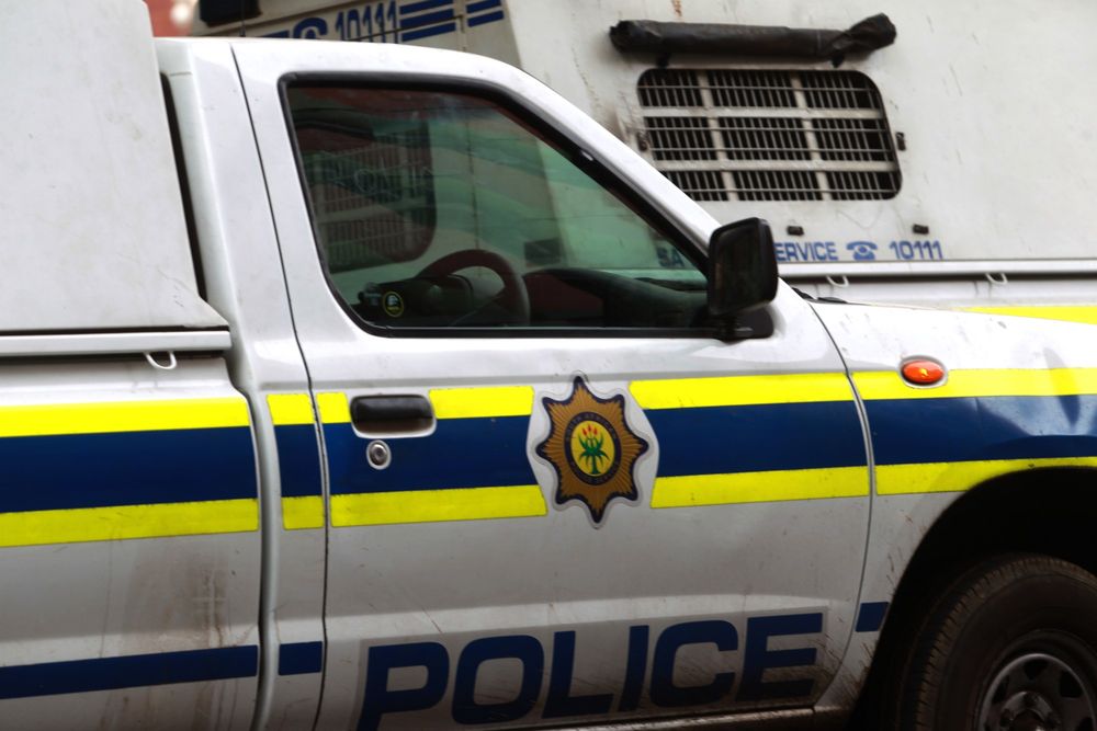 Three arrested after axe-attack on police officer
