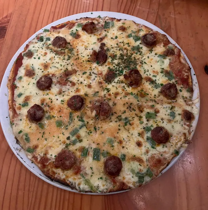 A chourizo, creamy leek and parsley pizza.