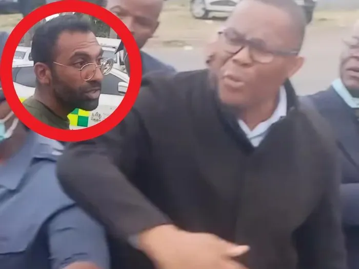eThekwini Mayor Cyril Xaba shooing the man away. 