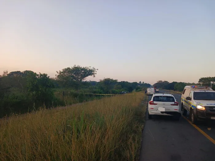 A suspected robber believed to be dead suddenly regained consciousness during a police forensic investigation following a dramatic shootout.