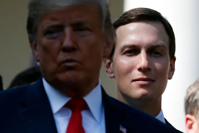 White House senior adviser Jared Kushner, right, stands behind President Donald Trump, left, Kushner likely paid little or no federal income taxes between 2009 and 2016, the New York Times reported. (AP Photo/Pablo Martinez Monsivais)