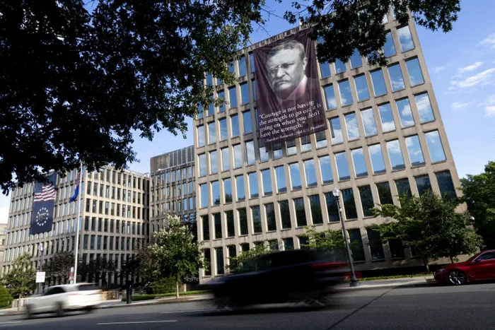 The banner on the Theodore Roosevelt Federal Building, which houses OPM, in D.C. 