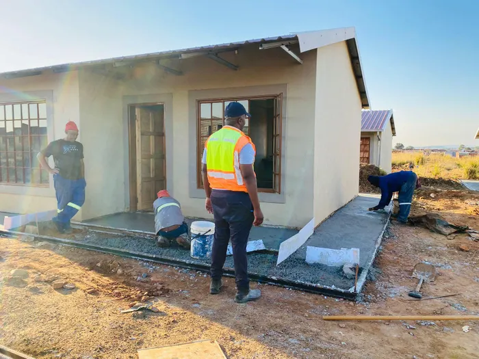 Work is being done on one of the finished houses on Wednesday afternoon. 