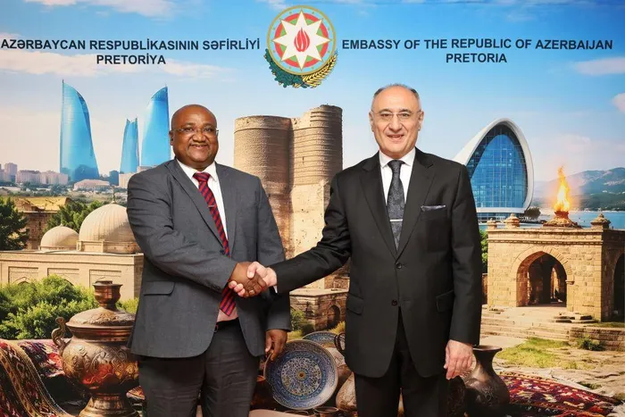 Dr Huseyn Rahimli from the Azerbaijan Embassy being congratulated by South African Human Settlements Director General Alex Moemi at the 108th anniversary of the Azerbaijan Democratic Republic (ADR) in Pretoria this week.