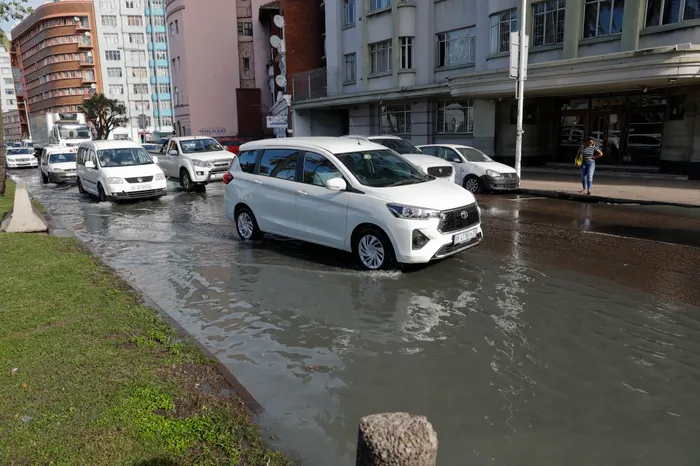  Motorists splash through pools of raw sewage water oozing on Margaret Mncadi, formerly known as Victori Embankment in Durban on Tuesday. The broken sewrage has been leaking raw sewage water for a couple of weeks in the area, creating a foul smell and congestion, with motorists trying to navigate the smelly water
Picture: Doctor Ngcobo/Independent Newspapers