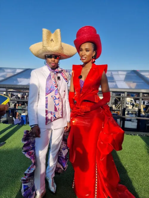 Zozibini Tunzi attends Hollywoodbets Durban July in a custom red gown