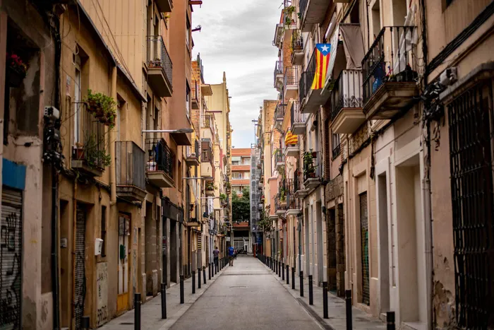 Discover the charming facades and scenic balconies within Barcelona's Gothic Quarter.
