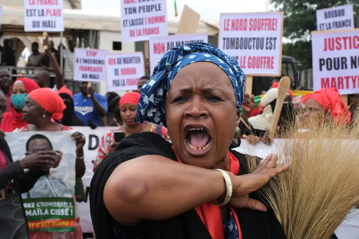 A woman shouts during a mass protest demanding the resignation of Mali's President Ibrahim Boubacar Keita in Bamako. Picture: Rey Byhre/Reuters