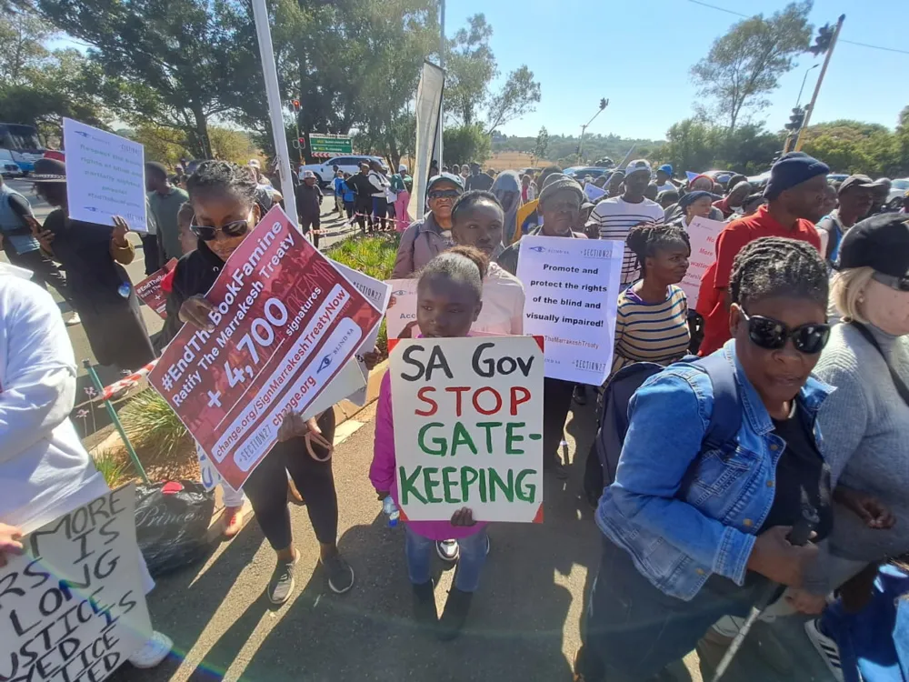 Activists including blind, visually impaired take to streets in bid for ...