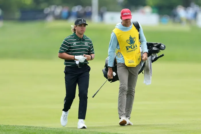 Garrick Higgo of South Africa walks the 16th hole alongside caddie Austin Gaugert during the first round of the PGA Championship at Aronimink Golf Club on May 14, 2026 in Newtown, Pennsylvania. Picture: Michael Reaves/Getty Images/AFP