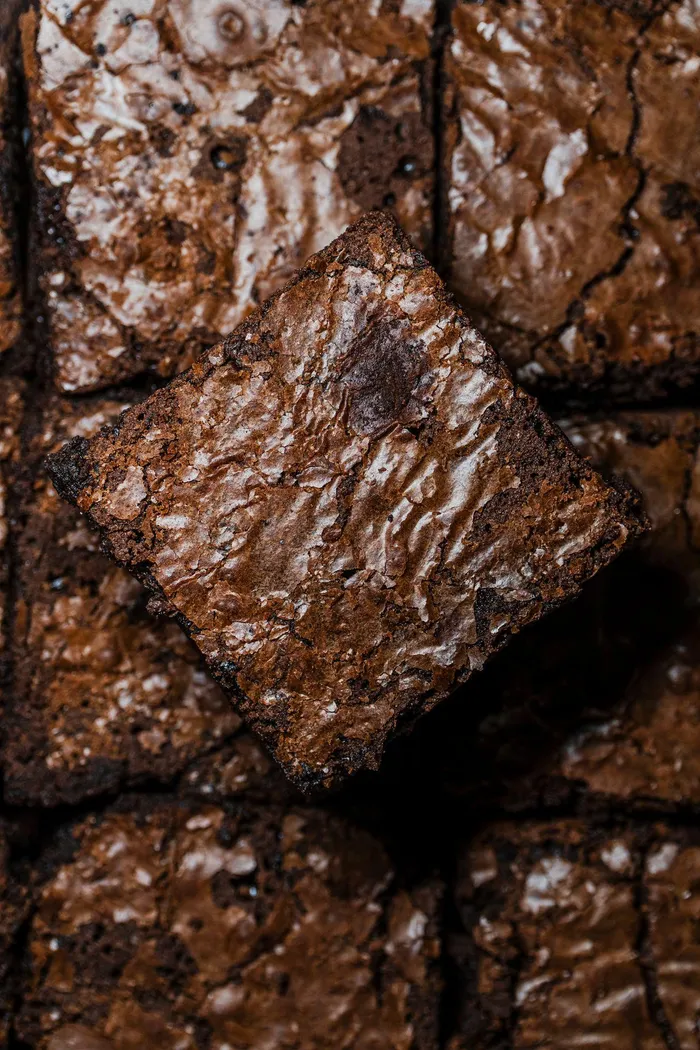 What makes people come back for another piece is the contrast between the delicate crackled top and the dense, chocolatey centre that stays soft for days.