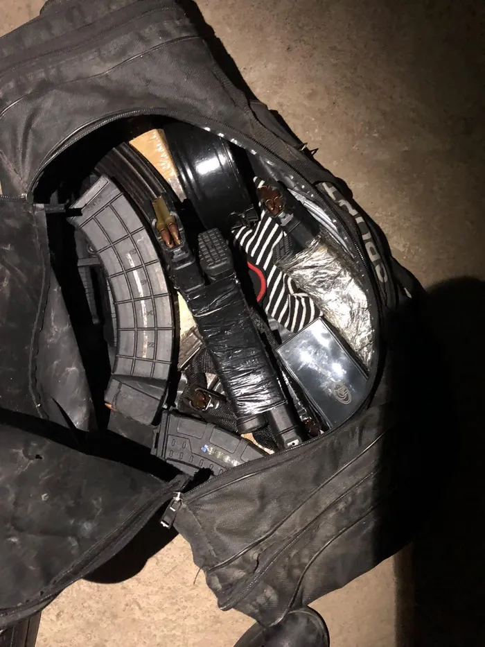 Seven rifles, a pistol and a hijacked BMW X5 were seized during a police raid on a property in Daveyton linked to a suspected cash-in-transit robbery gang.