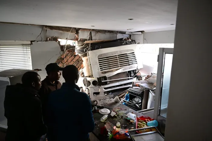 A container truck collided with a house in Bothasig, leaving one person injured and the occupants shaken but unharmed.