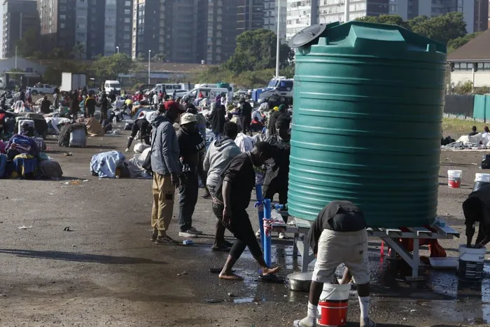 Thousands of Malawian foreign nationals, seeking refuge at the Durban drive-in site on North Beach, are going about their business, doing their laundry, shaving their hair, and selling food and other accessories, while others take advantage of Durban's warm weather, basking in the sun, waiting for their repatriation processes