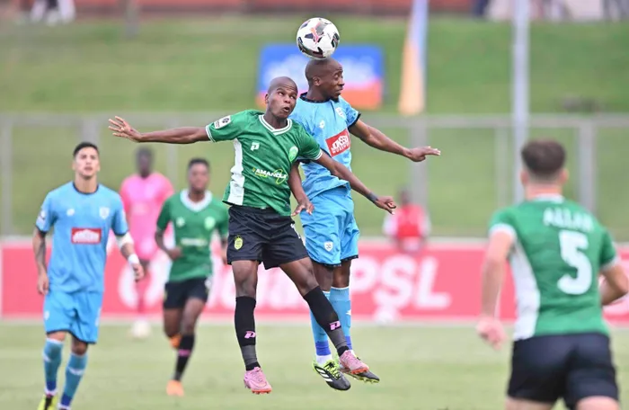 AmaZulu's Siphamandla Zikhali and Durban City's Thabo Ndoda go for the ball during their Betway Premiership match.