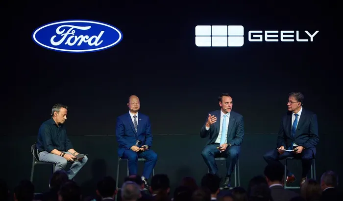 Nan Shengliang (2nd L), vice president of Geely Auto Group, and Jim Baumbick (3rd L), president of Ford Europe attend an event to announce the deal in Valencia, Spain, July 23, 2026. Geely Automobile Holdings and Ford Motor Company on Thursday announced a deal to produce new energy vehicles for the European market at Ford's manufacturing plant in Valencia, Spain.