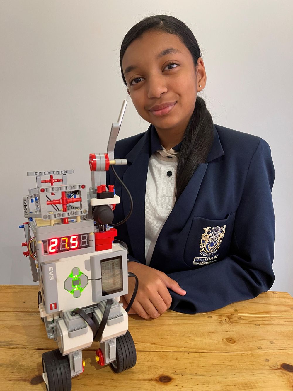 Teen turns robotics success into coding lessons