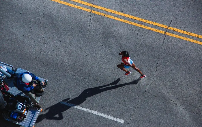 A 49-year-old UK woman who claimed she was unable to walk due to arthritis has been jailed for seven months after she was caught running a 10-kilometre marathon and attending multiple gym classes.