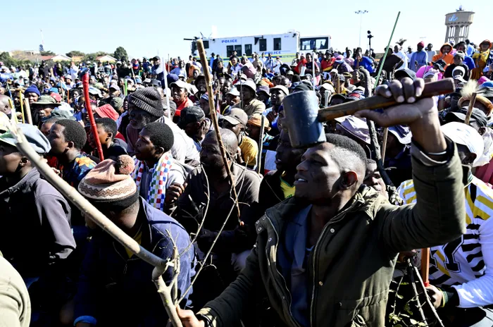 Residents of Soweto took to the streets on Monday, wielding traditional weapons including shields and sticks, to protest against illegal immigrants amid growing socio-economic tensions.