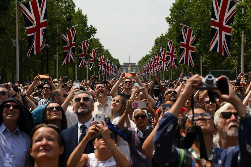 Members of the public watch a fly-past of aircraft by the Britain's Royal Air Force from The Mall, as part of the King's Birthday Parade, 'Trooping the Colour', in London on June 17, 2023.  Picture: Daniel Leal / AFP