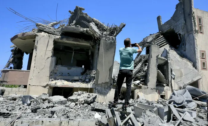 A man inspects damage following Israeli bombardment on a building in the village of Saksakiyeh in southern Lebanon on June 6, 2026.