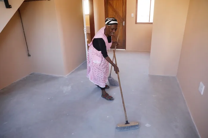 Ntombi Shabane cleans her new home and shares her joy after years of waiting for a home.